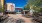 view of colorful retail storefronts and outdoor seating areas in local neighborhood